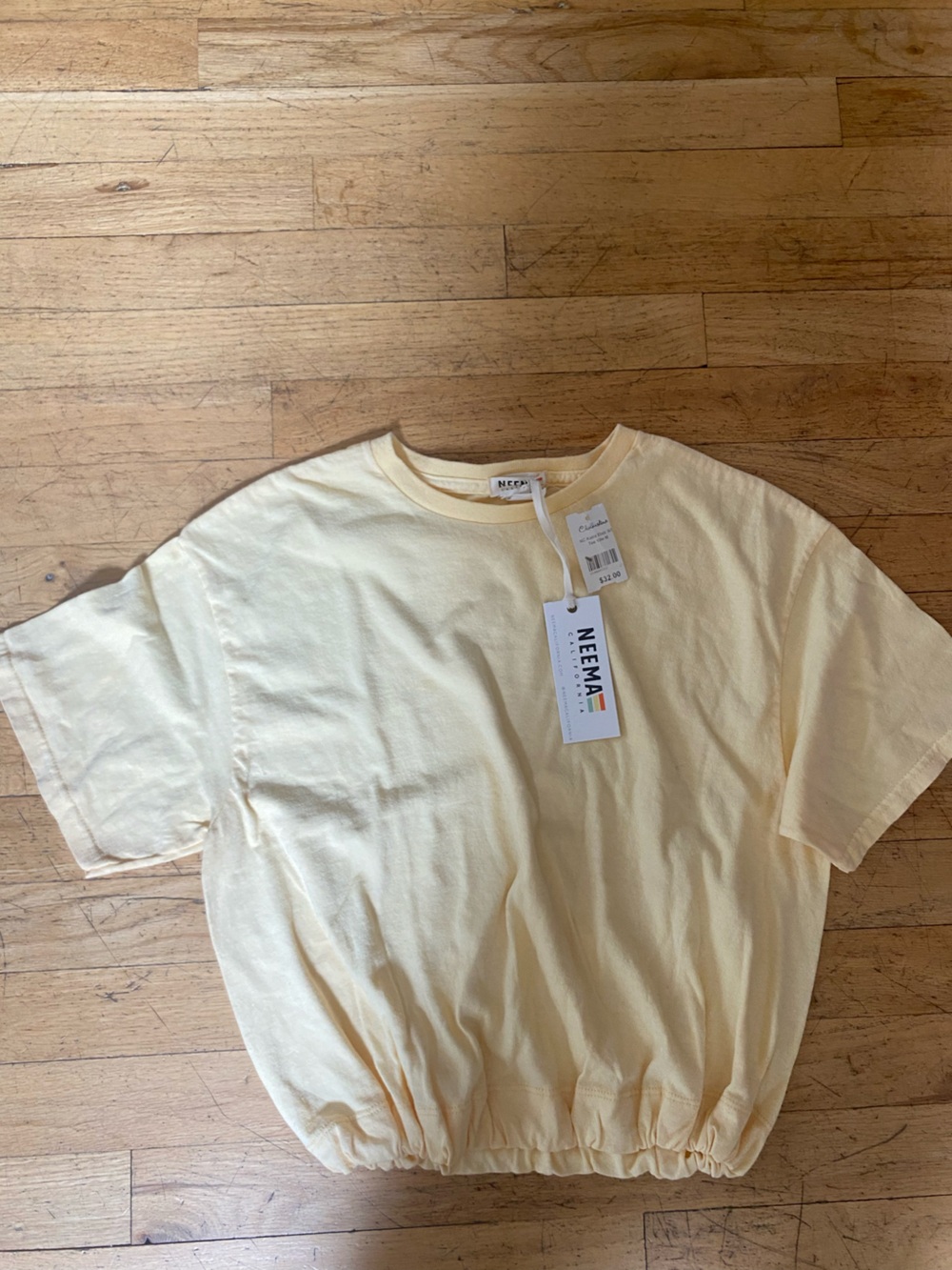 Neema yellow t shirt. Elastic bottom. Size medium. NWT